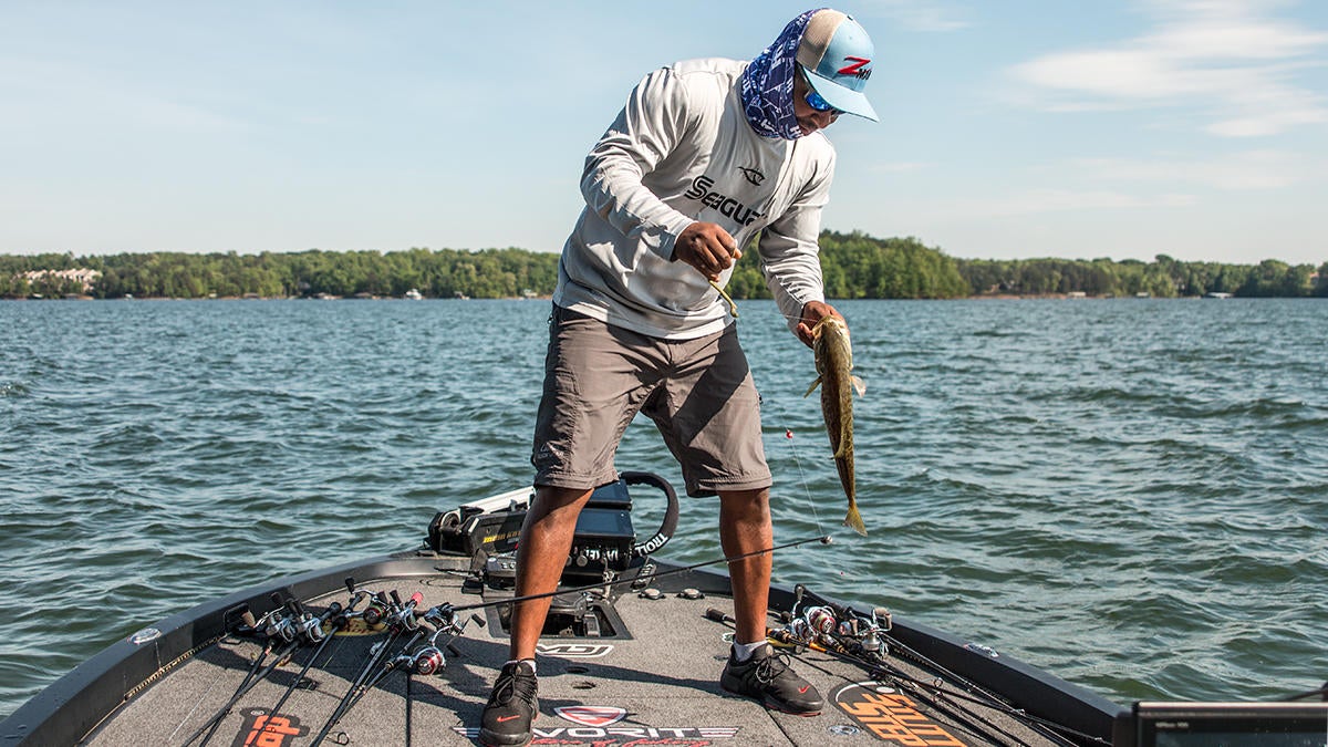 mark-daniels-jr-unhooking-bass.jpg