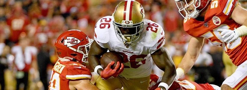 <p>Aug 24, 2019; Kansas City, MO, USA; San Francisco 49ers running back Tevin Coleman (26) runs the ball and is tackled by Kansas City Chiefs defensive back Daniel Sorensen (49) and inside linebacker Darron Lee (50) during the first half at Arrowhead Stadium.</p>