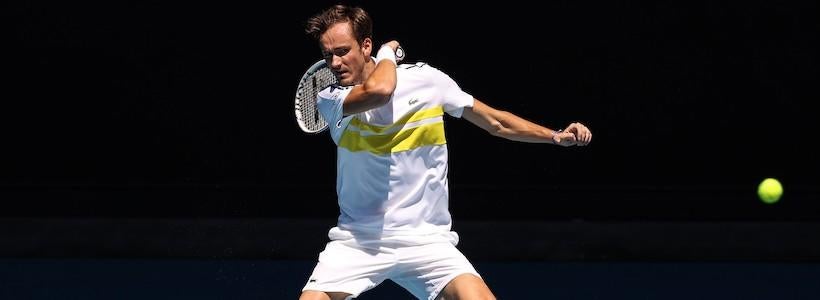 <p>MELBOURNE, Feb. 15, 2021 -- Daniil Medvedev of Russia hits a return during the men's singles match against Mackenzie McDonald of the United States at Australian Open in Melbourne Park in Melbourne, Australia, Feb. 15, 2021. (Photo by Bai Xuefei/Xinhua via Getty) (Xinhua/Bai Xuefei via Getty Images)</p>