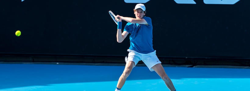 <p>MELBOURNE, AUSTRALIA - FEBRUARY 07: Jannik Sinner of Italy plays a backhand in his Men's Singles Final match against Stefano Travaglia of Italy during day seven of the ATP 250 Great Ocean Road Open at Melbourne Park on February 07, 2021 in Melbourne, Australia. (Photo by Andy Cheung/Getty Images)</p>