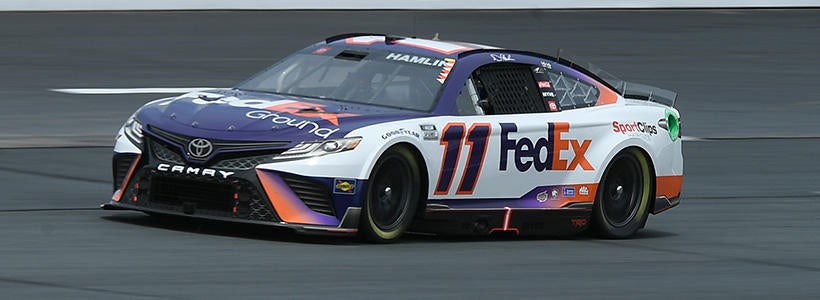 <p>Jul 16, 2022; Loudon, New Hampshire, USA; NASCAR Cup Series driver Denny Hamlin (11) drives during the qualifying round of the Ambetter 301 at New Hampshire Motor Speedway.</p>