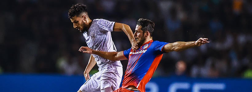 <p>BAKU, AZERBAIJAN - AUGUST 17: Abdellah Zoubir (10) of Qarabag and Milan Havel (24) of Viktoria Plzen fight the ball during the UEFA Champions League Play-Off First Leg match between FK Qarabag v Viktoria Plzen at Tofiq Bahramov Stadium on August 17, 2022 in Baku, Azerbaijan.</p>