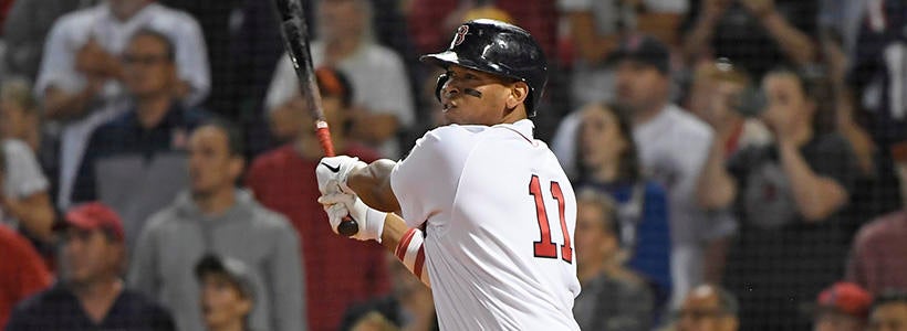 <p>Sep 1, 2022; Boston, Massachusetts, USA; Boston Red Sox third baseman Rafael Devers (11) hits an RBI double during the ninth inning against the Texas Rangers at Fenway Park.</p>