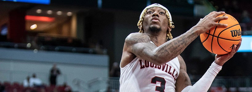 <p>Louisville's El Ellis lays in two of his 28 points against Chaminade. Nov. 3, 2022  Af5i9159</p>