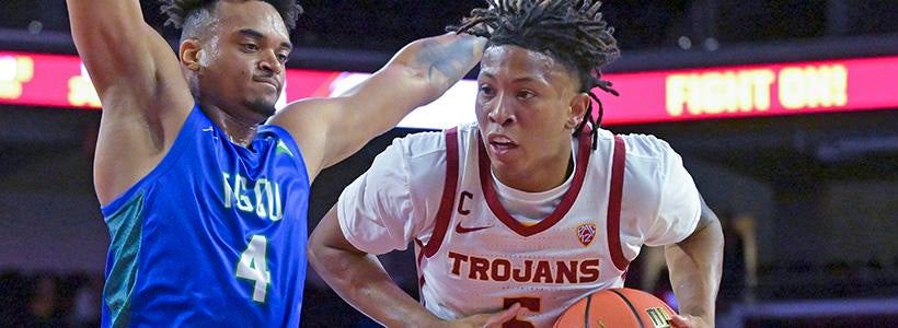 <p>Nov 7, 2022; Los Angeles, California, USA; Florida Gulf Coast Eagles guard Cyrus Largie (4) defends USC Trojans guard Boogie Ellis (5) as he drives to the basket in the first half at Galen Center.</p>