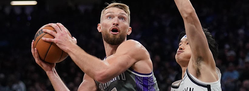 <p>Nov 15, 2022; Sacramento, California, USA; Sacramento Kings forward Domantas Sabonis (10) holds onto the ball next to Brooklyn Nets guard Yuta Watanabe (18) in the third quarter at the Golden 1 Center.</p>