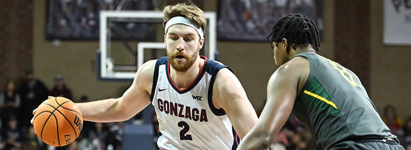<p>Dec 2, 2022; Sioux Falls, South Dakota, USA;  Gonzaga Bulldogs forward Drew Timme (2) drives against Baylor Bears forward Flo Thamba (0) in the first half at Sanford Pentagon.</p>
