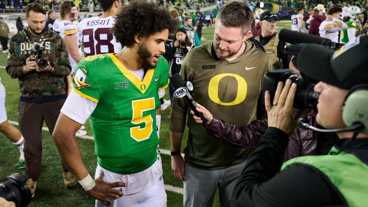 <p>Dante Moore and Dan Lanning, Oregon</p>